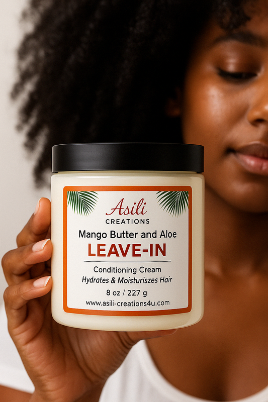 Black woman with Type 4 curls applying rich, creamy leave-in conditioner to her hair for deep moisture and curl definition